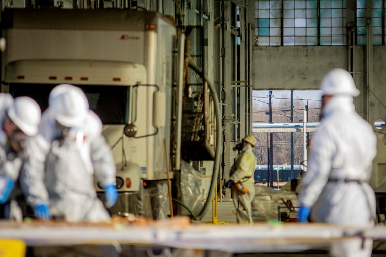 Workers conduct activities for a study of groundwater contamination beneath the C-400 Cleaning Building following deactivation of the facility.