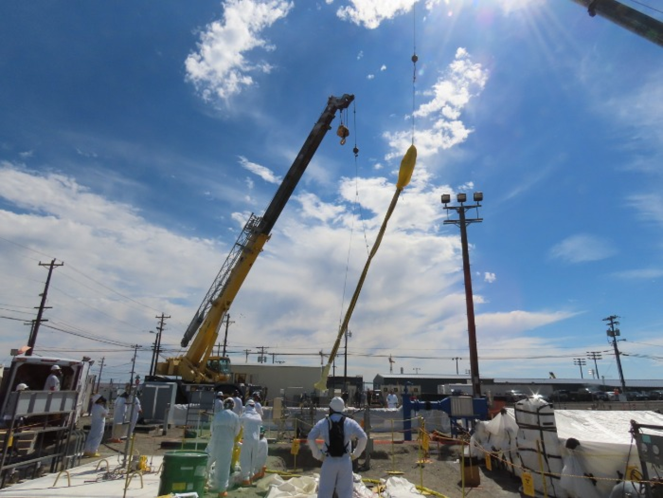 Workers remove a pump from Double-Shell Tank AW-102, allowing for the installation of a new pump to feed waste to the Hanford Site's 242-A Evaporator.