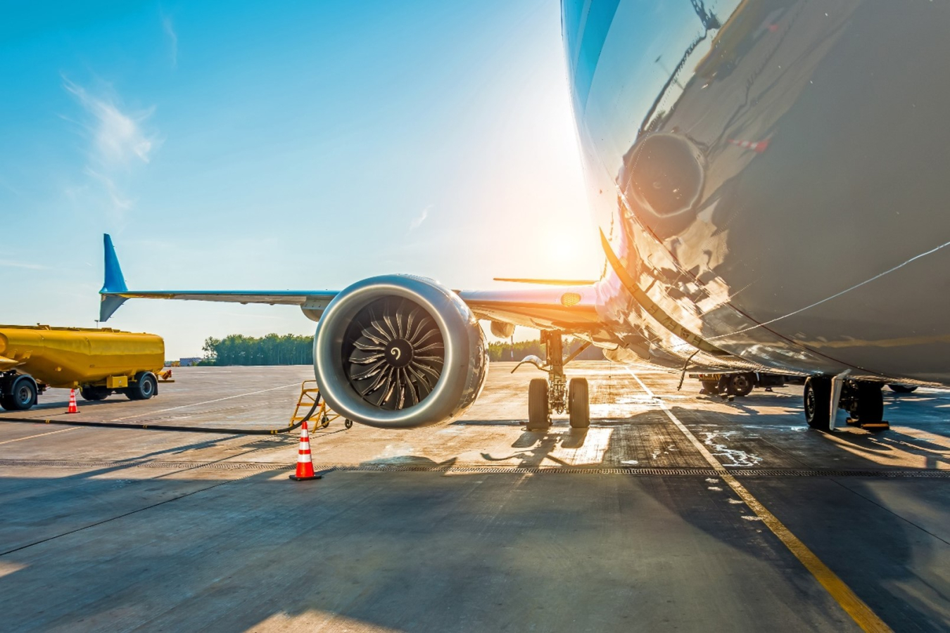 a image of a jet refueling at an airport.