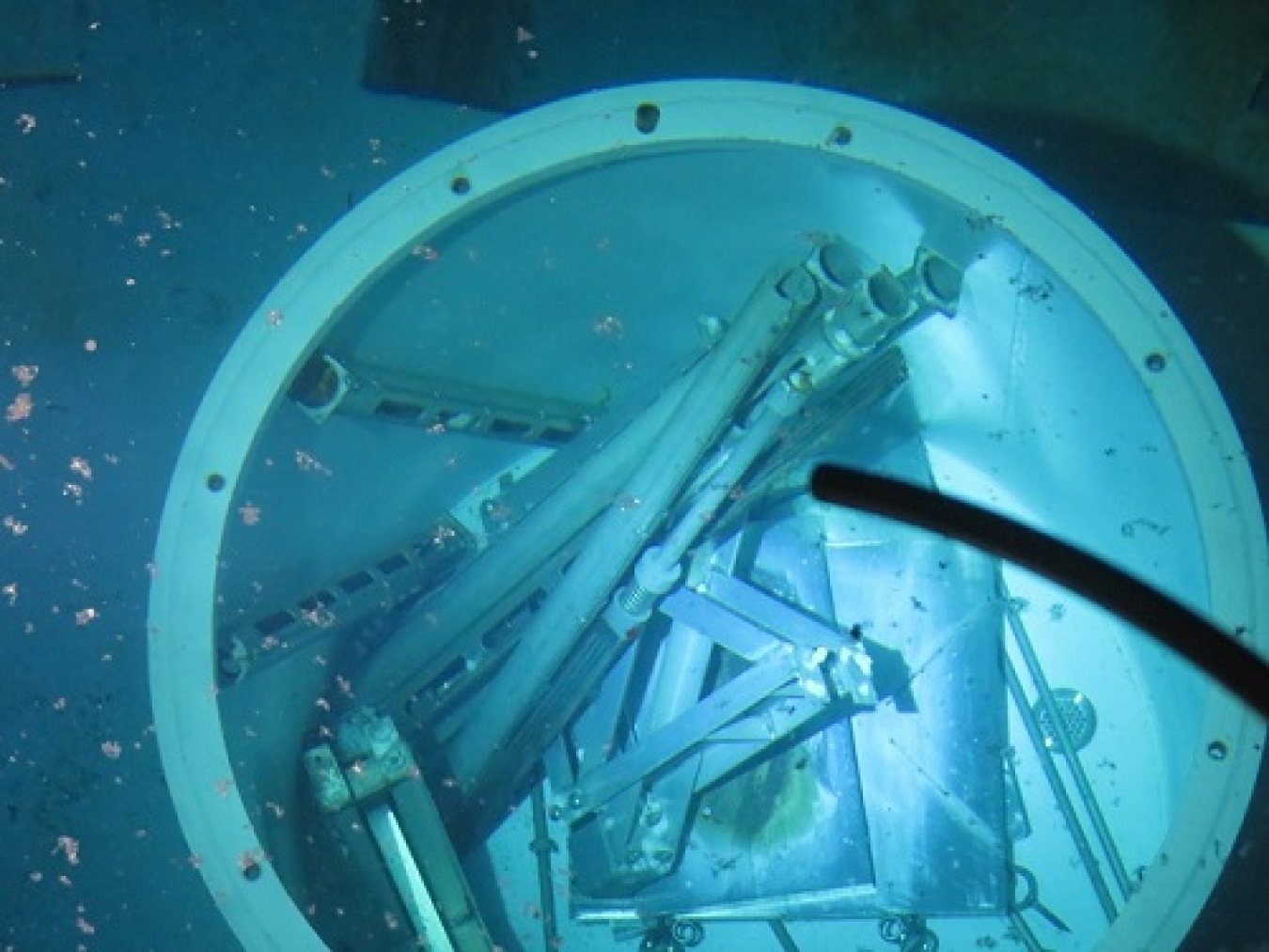 Oak Ridge workers reduced the size of irradiated materials and placed them into a 6,100-pound waste transfer liner set 21 feet deep in the reactor pool.