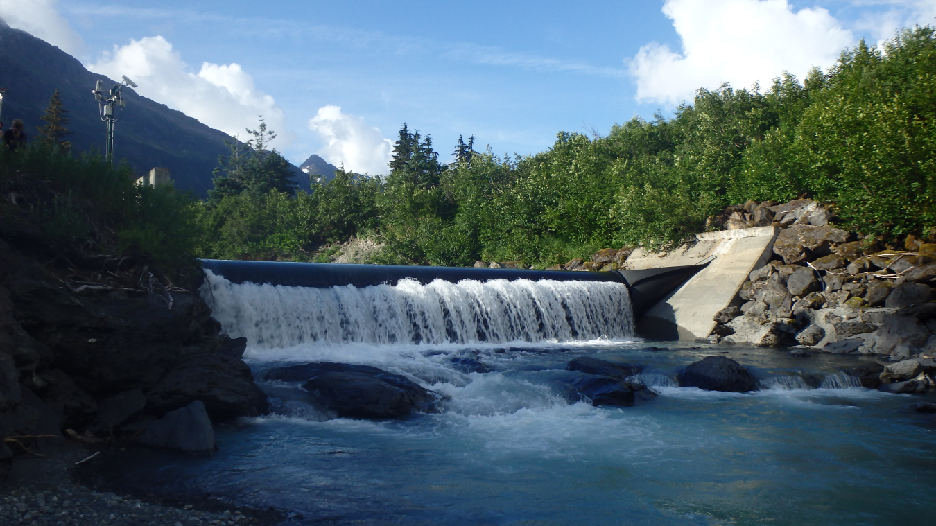 Photo of water over dam at Cordova Electric Collective.