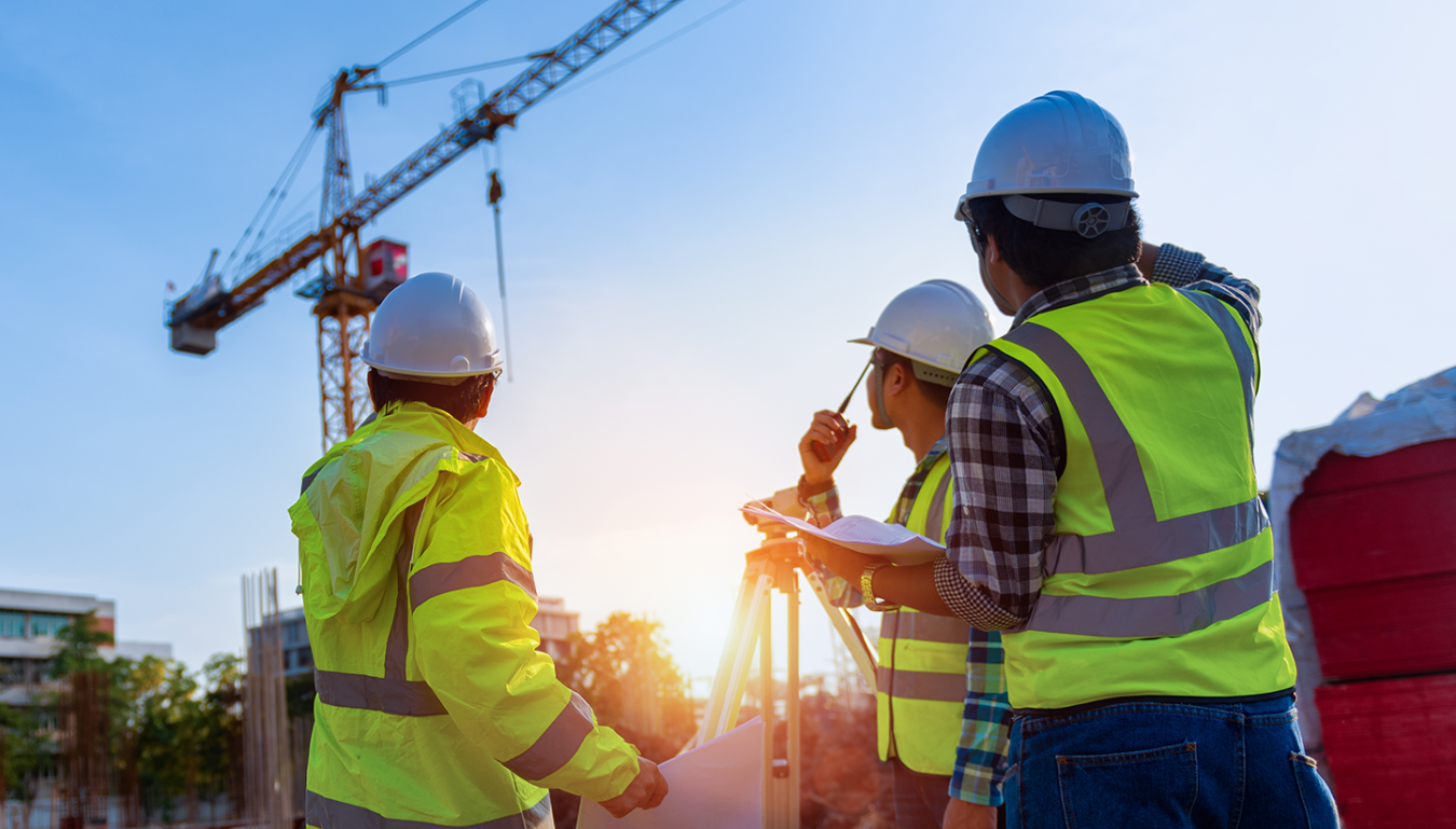 Construction engineers discussion with architects at construction site or building site