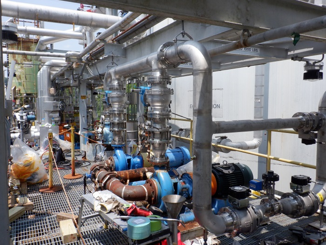 A view of the contrast between piping that is decades old — the rusted brown pipes in the foreground — and new piping workers are installing in the Liquid and Gaseous Waste Operations system at Oak Ridge National Laboratory. The replacements will alleviate the recurring need for maintenance and repairs and ensure the system’s reliability.