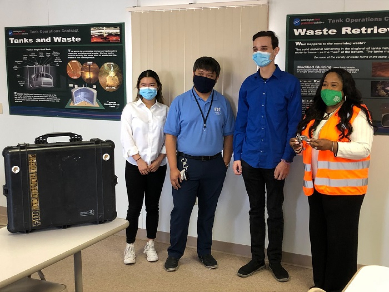 Florida International University interns, from left, Thi Tran, Jeff Natividad, and Joel Adams, meet with Nicole Nelson-Jean, EM Associate Principal Deputy Assistant Secretary for Field Operations, far right, during her visit to the Hanford Site in June 2021