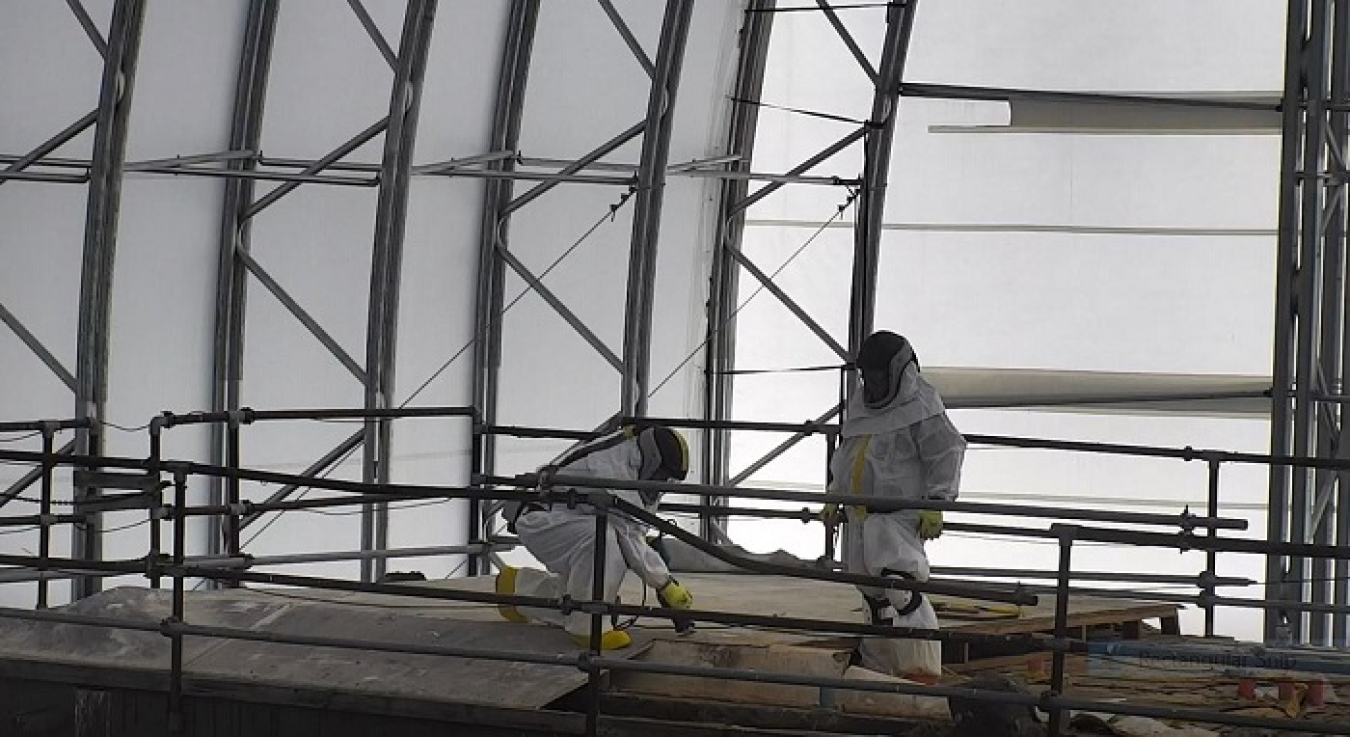 EM workers cut through the roof of the final hot cell at the former Radioisotope Development Laboratory at Oak Ridge National Laboratory for characterization work.