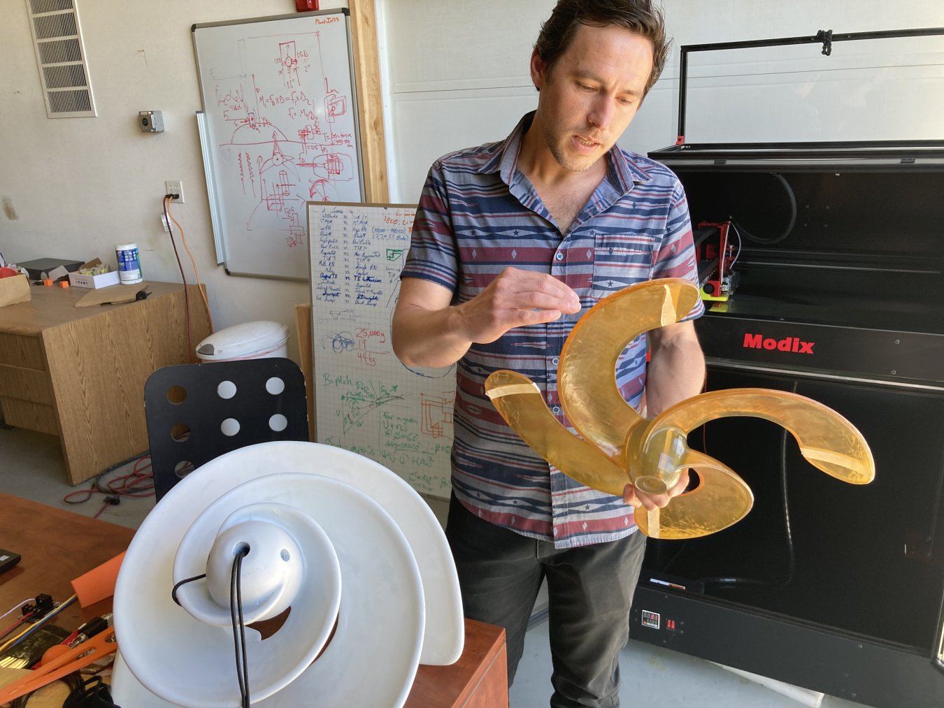 BladeRunner CEO Moriel Arango shows an advanced 3D printing technology prototype for a hydrokinetic device.