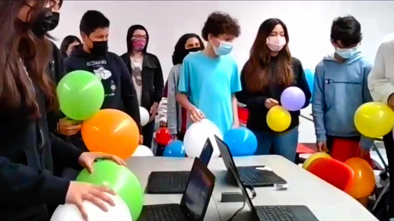 Students ready their balloons for a hands-on experiment about nuclear fission. The experiment was part of a virtual demonstration hosted by the Argonne Hispanic/Latino Club ERG during Hispanic/Latino Education Outreach Day. 