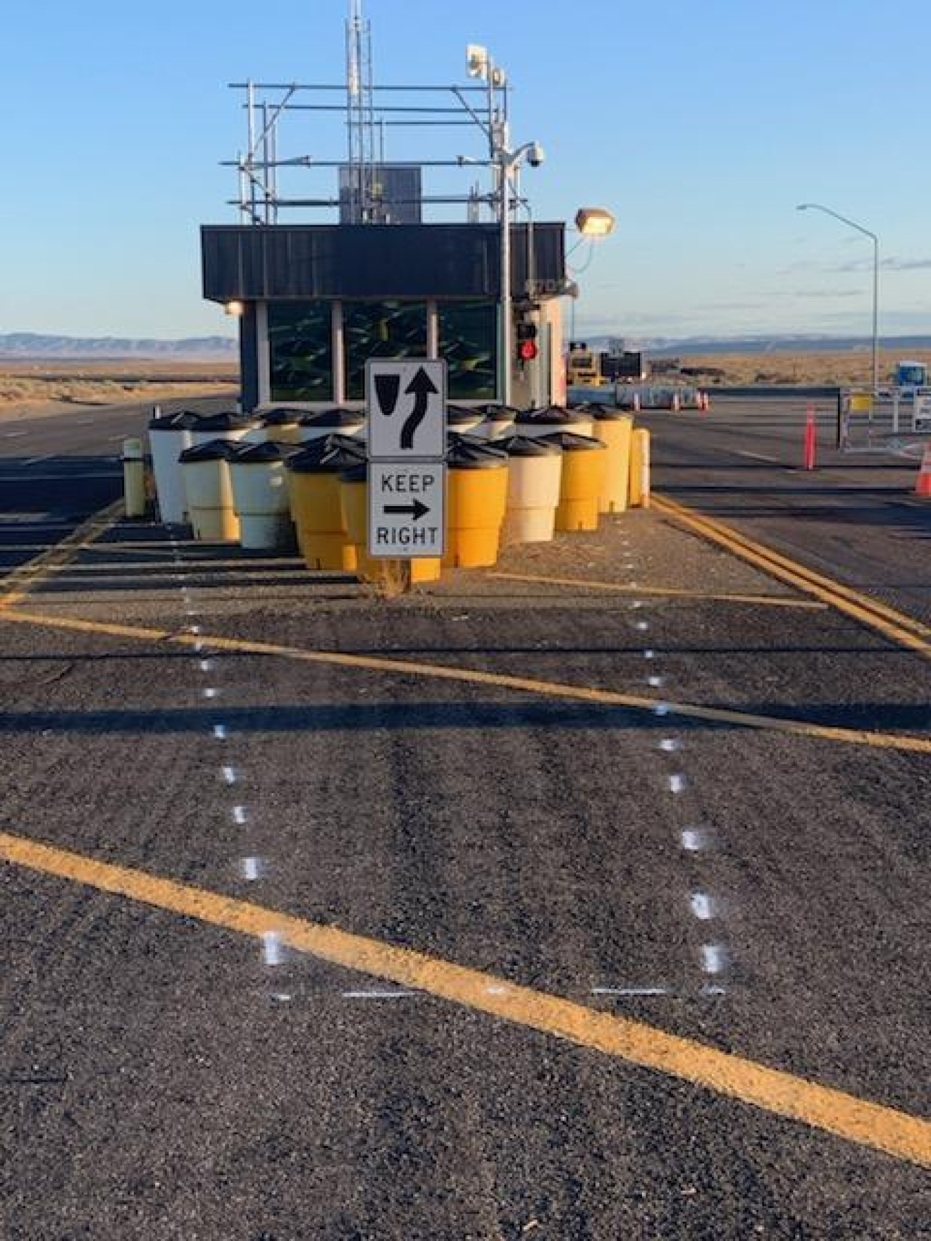 Before: The Hanford Site previously used an arrangement of sand barrels to provide an added layer of vehicle protection to the site’s access points. 