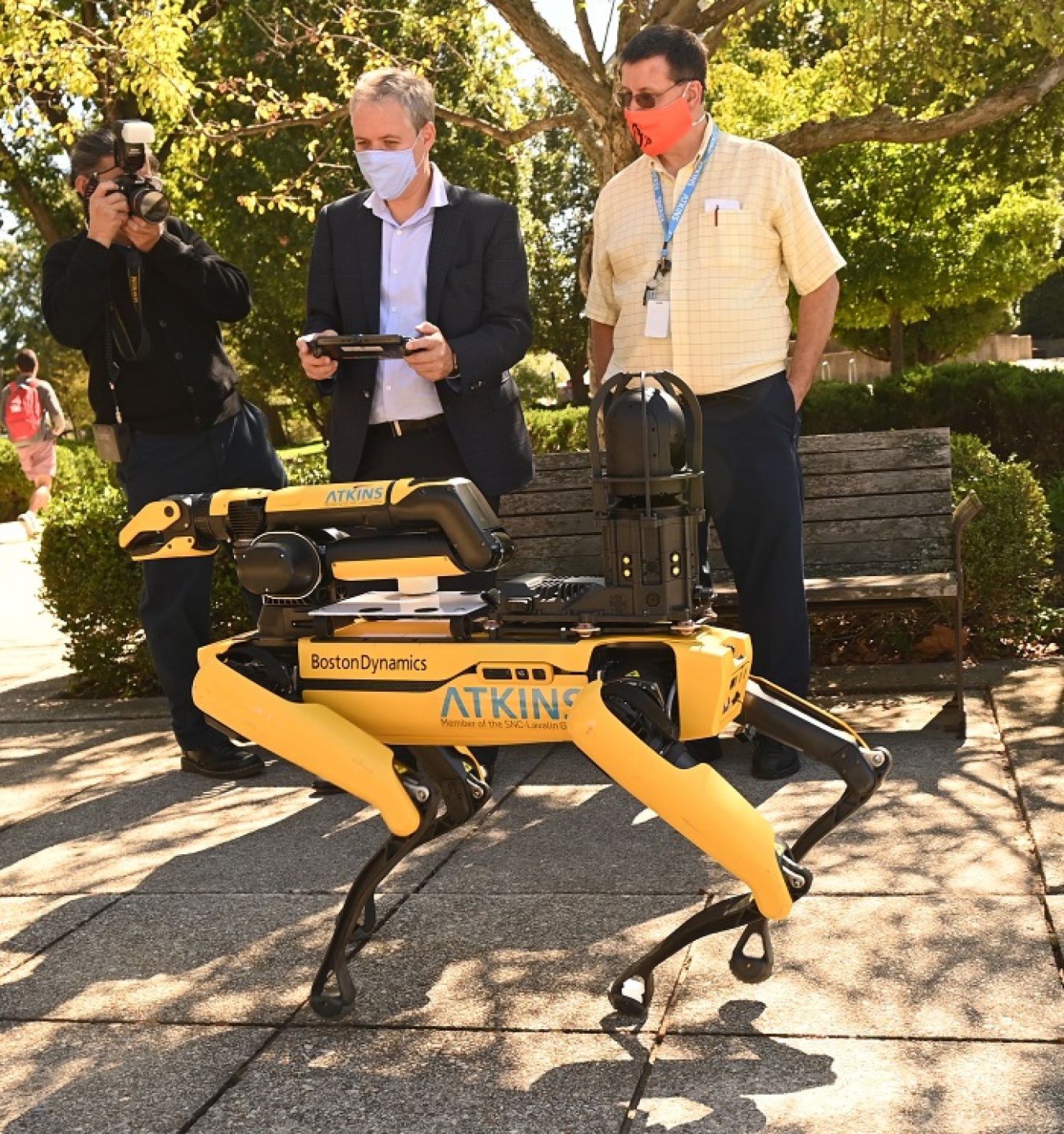 Atkins Robotics Engineer Kevin Maze shows EM Acting Assistant Secretary William "Ike" White how to operate the Spot quadruped robot during a recent visit to Catholic University’s Vitreous State Laboratory.