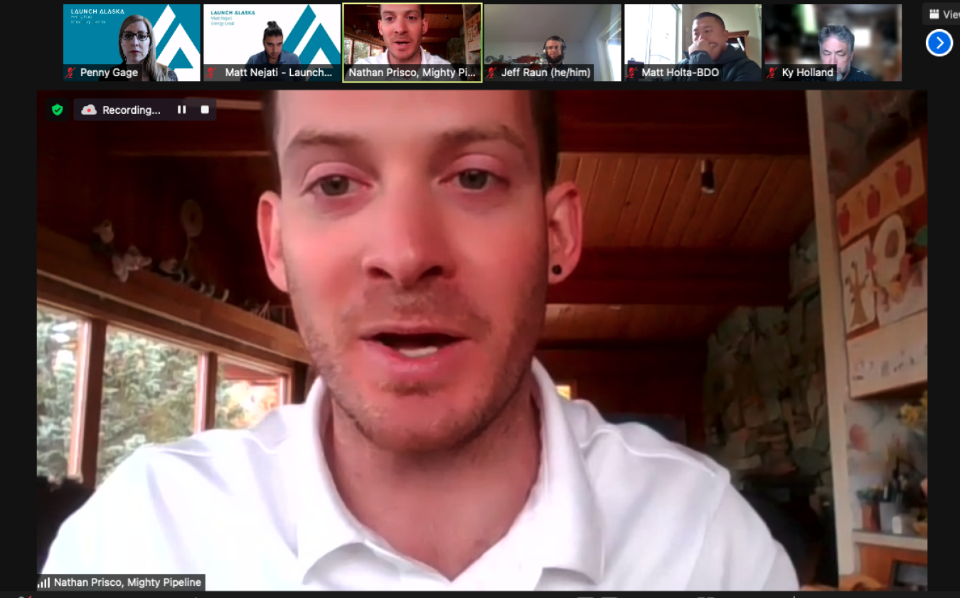 A screen shot of a Zoom meeting with the largest screen on Nathan Prisco. 