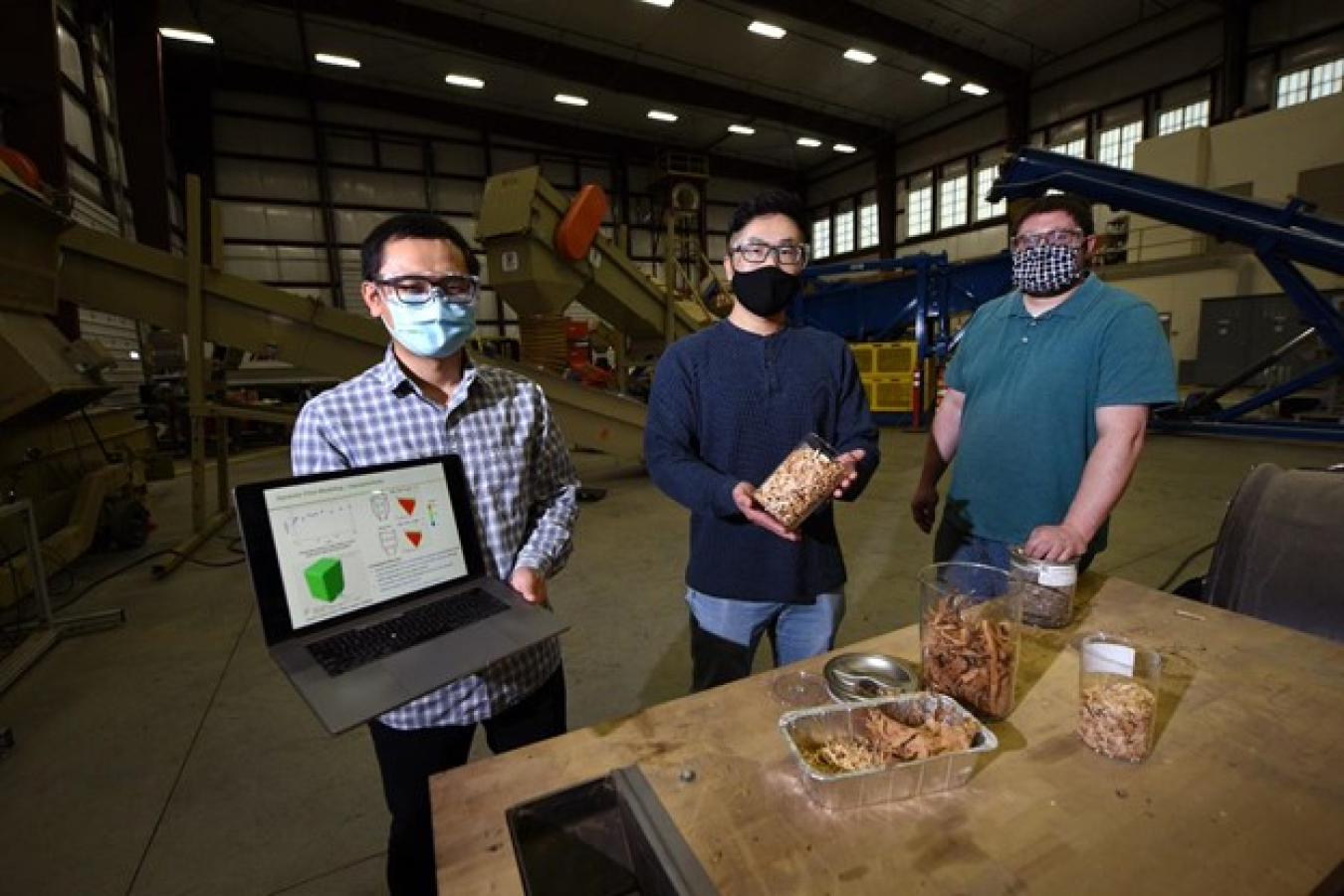 INL bioenergy research team - 3 men looking at feedstocks