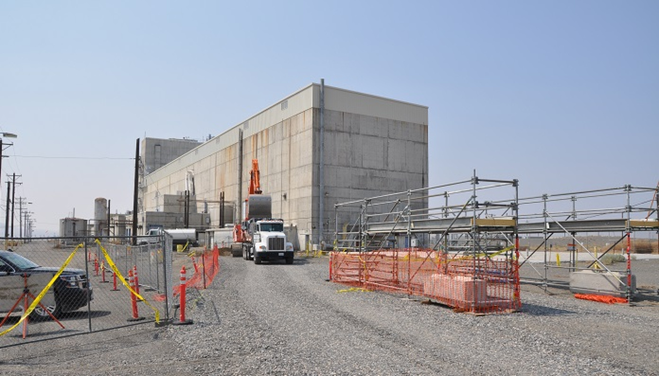 Workers with EM contractor Central Plateau Cleanup Company are performing construction activities to support the connection of three new exhauster units to the Reduction-Oxidation Plant on the Hanford Site.