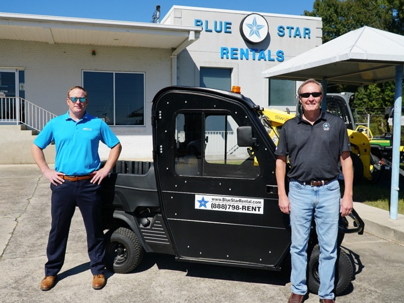 Michael Klecker with Savannah River Remediation (SRR), left, is shown with Randy Chafin, owner of Blue Star Rental and Sales. Klecker serves as a mentor to Chafin in the SRR Mentor-Protégé Program. The utility cart pictured is the same model as one that U&E rents to SRR.