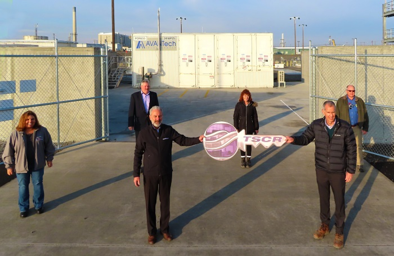 Hanford Site leadership is handed a symbolic key from Washington River Protection Solutions (WRPS) to indicate construction and readiness assessments are complete on the Tank-Side Cesium Removal system. 