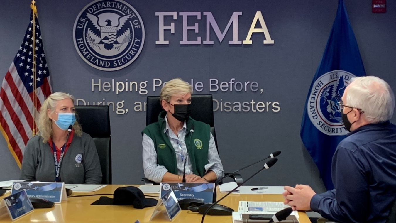 Secretary Granholm at a FEMA briefing table