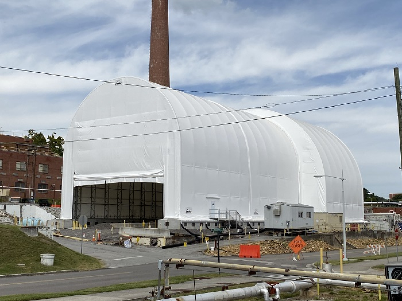 Workers finished installing a six-story protective cover over Building 3026’s remaining contaminated structures last year. 