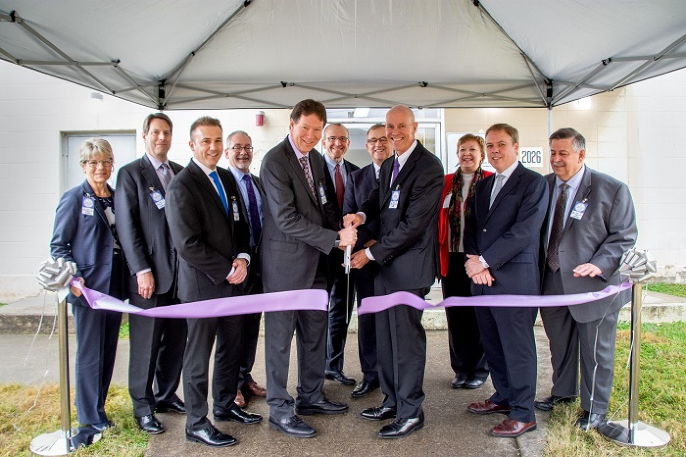 In this 2019 photo, officials cut a ribbon to mark the launch of a new public-private partnership that provides unique isotopes to aid in next-generation cancer research and treatment while advancing nuclear cleanup at Oak Ridge.