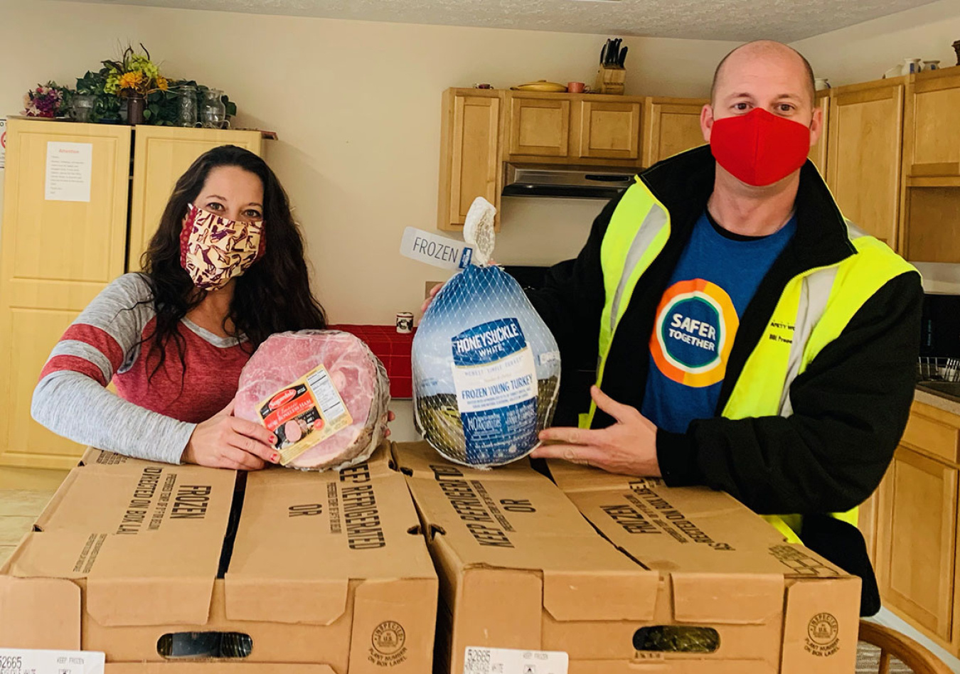 Southern Ohio Domestic Violence Shelter was one of several local charities receiving a special delivery of turkeys and hams for the holidays. Pictured, from left, is Sara Justice, Southern Ohio Domestic Violence Shelter, and Todd Cron (FBP).
