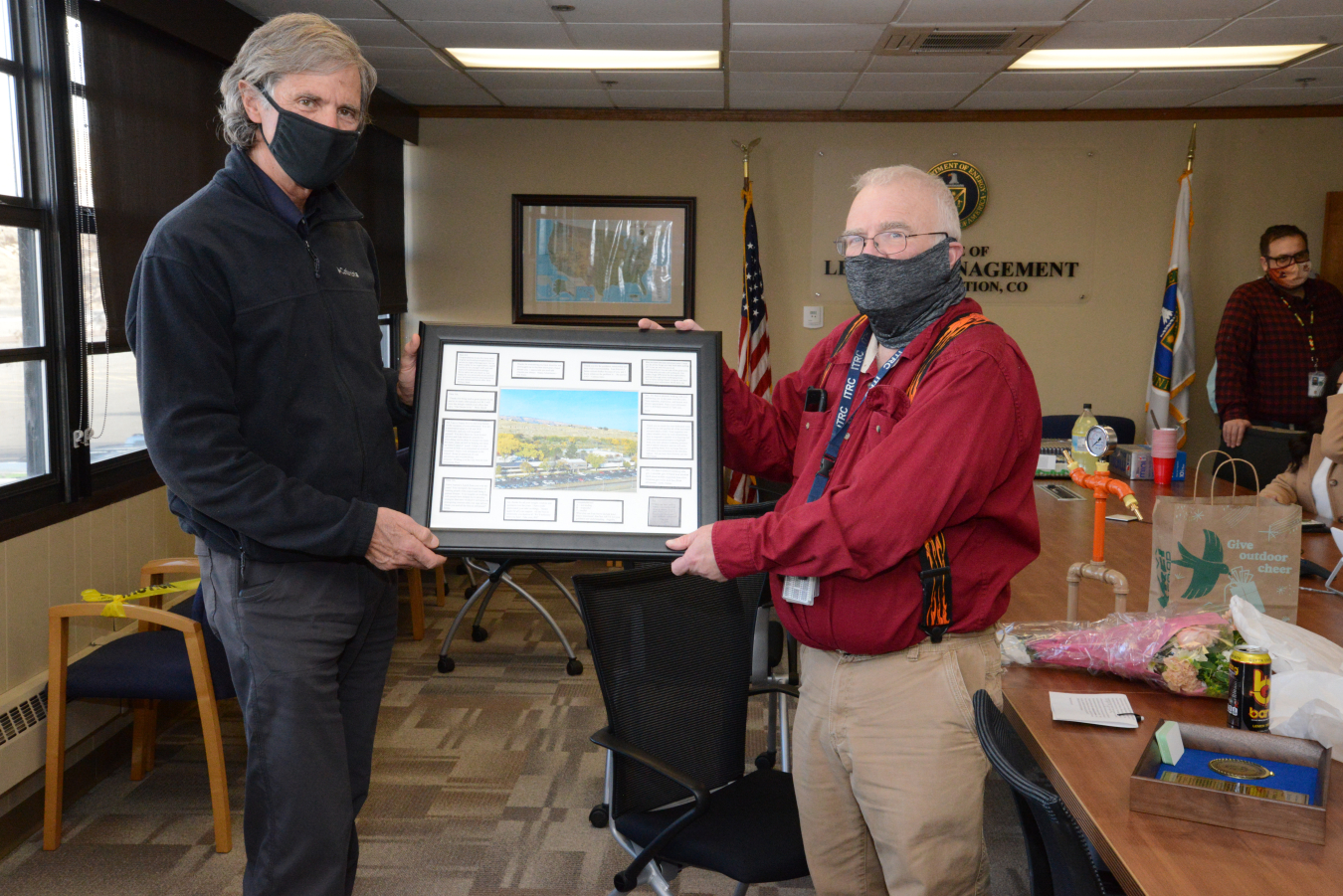 At his retirement party, Site Manager Mark Kautsky presented Art Kleinrath with a framed picture of LM’s Grand Junction office signed by Kleinrath's colleagues.