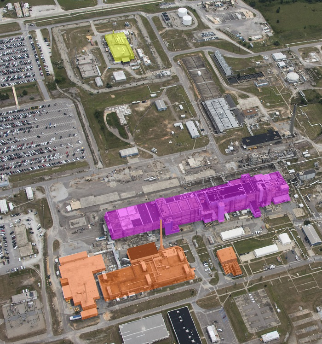 An aerial view of F Area at the Savannah River Site. Building 235-F is highlighted in yellow, F/H Analytical Laboratory facilities are highlighted in orange, and F Canyon/FB Line are shown in purple.