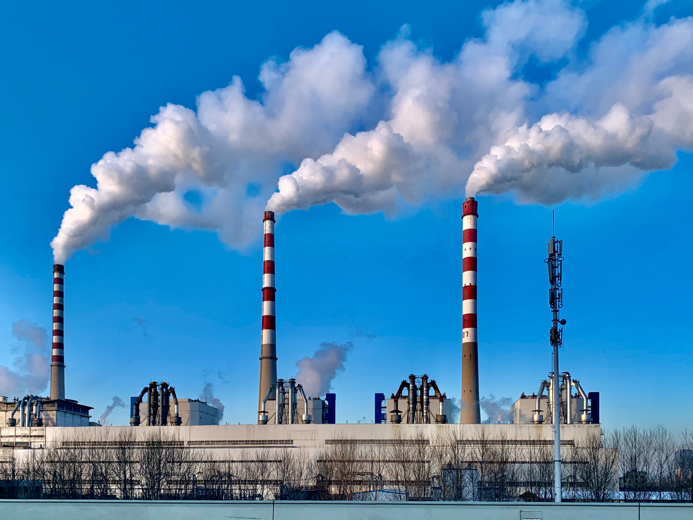 Power plant with smokestacks.