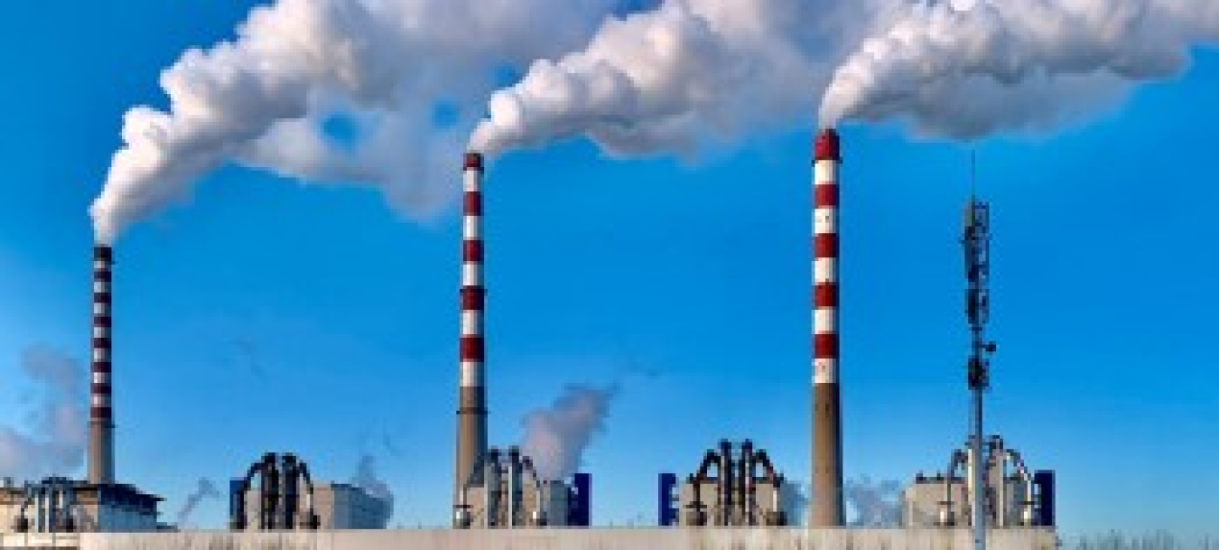 A power plant with smokestacks.