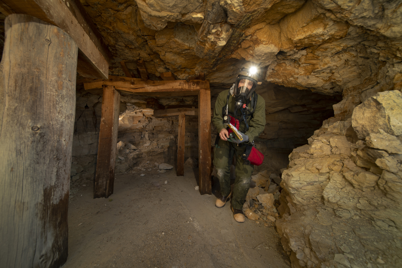 Aaron Sidder from Bat Conservation International passes cap and post timbers en route to the mine portal. (Photo by Bill Hatcher/BCI.)