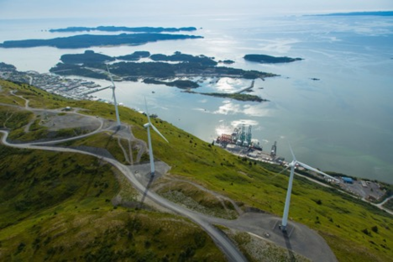 Wind turbines generate electricity on top of Pillar Mountain in Alaska.
