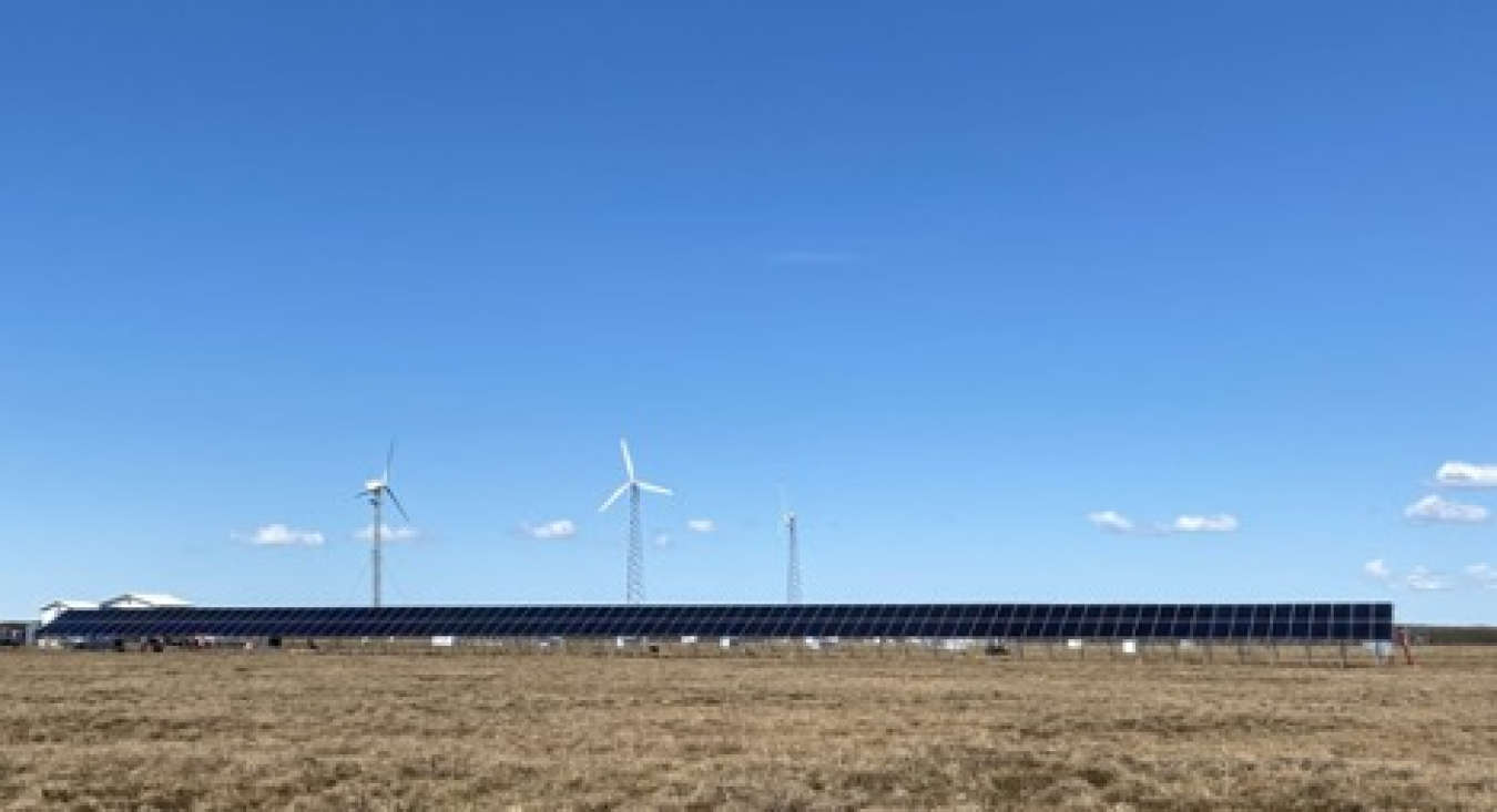 Wind turbines generate power in a field in Kotzebue, Alaska.