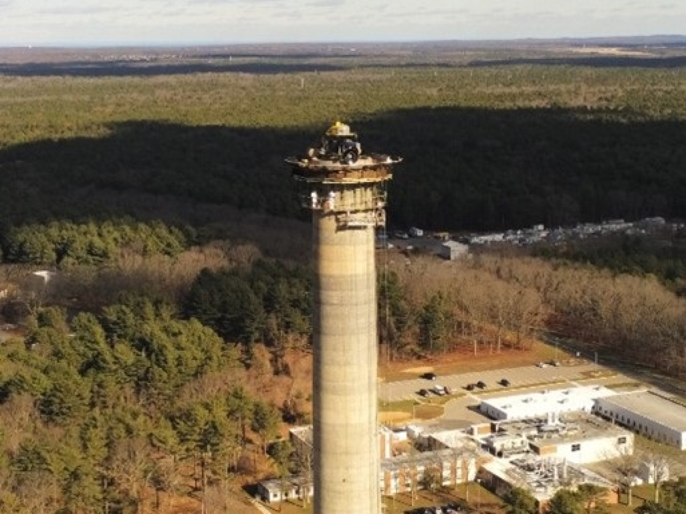 Midway through demolition of the Brookhaven National Laboratory’s High Flux Beam Reactor exhaust stack.