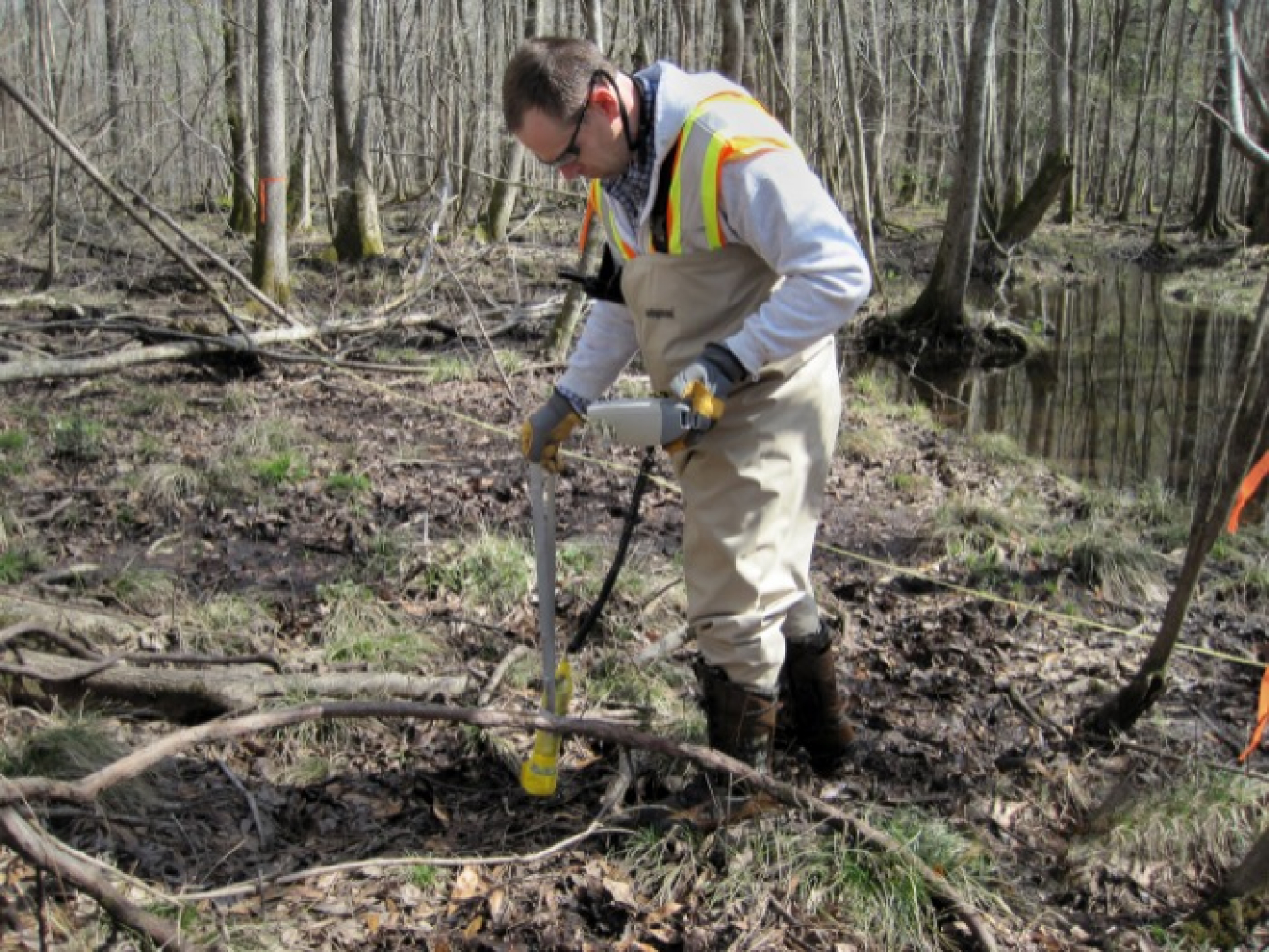 A Savannah River Nuclear Solutions subcontractor technician takes radiological readings of soil near Lower Three Runs, part of a major project to complete the cleanup of a contaminated 25-mile-long stream corridor at the Savannah River Site.