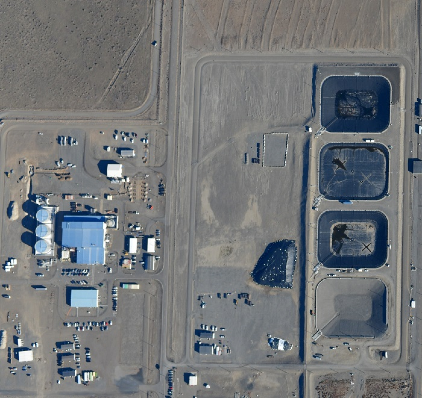 This aerial photo shows the Effluent Treatment Facility, at left, and the four basins where wastewater from Hanford Site projects is stored before it is processed. Approximately 1 million gallons of wastewater are expected to be treated during the current campaign.