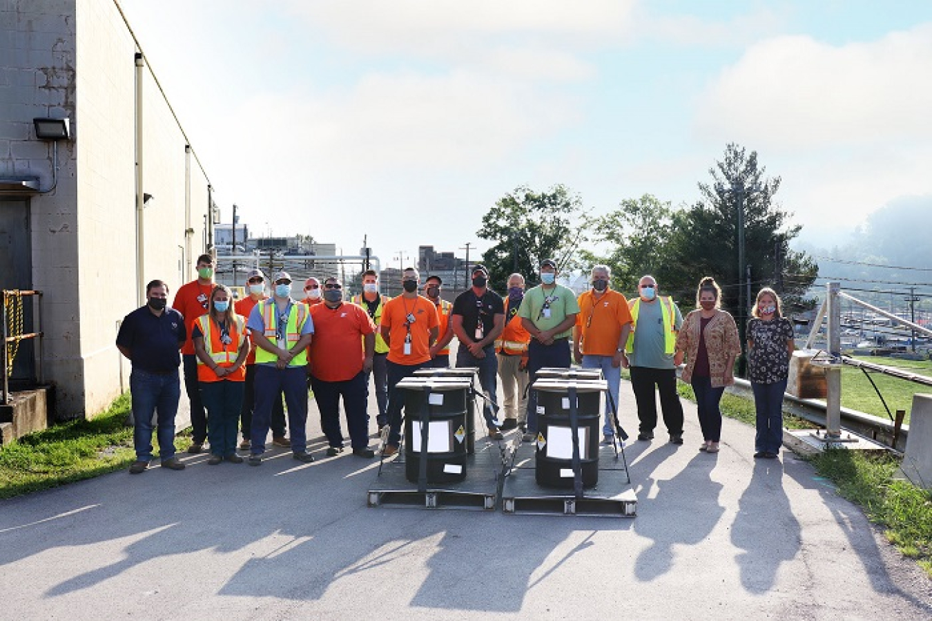 Employees with Isotek, an Oak Ridge Office of Environmental Management contractor, are pictured with some of the final low-dose material that was processed and shipped for disposal in late 2021. This year the contractor is scheduled to begin processing the high-dose inventory in hot cells.