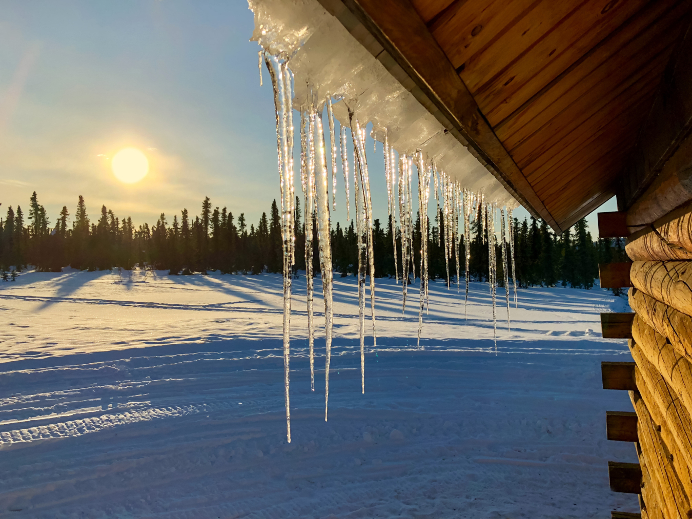 Icicles-on roof-and-sunset