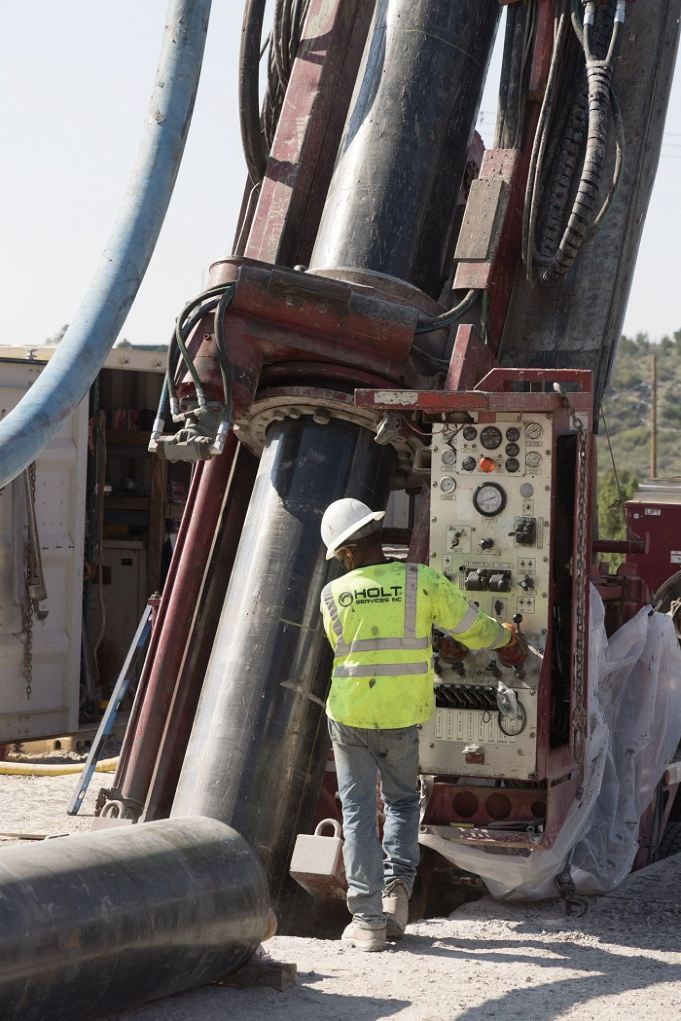 While drilling a borehole for a groundwater monitoring well, EM crews check the angle of the drill rod to ensure accurate intersection with the desired sampling locations. Known as R-71, the well will support further characterization of a contaminant plume in groundwater beneath Los Alamos National Laboratory.