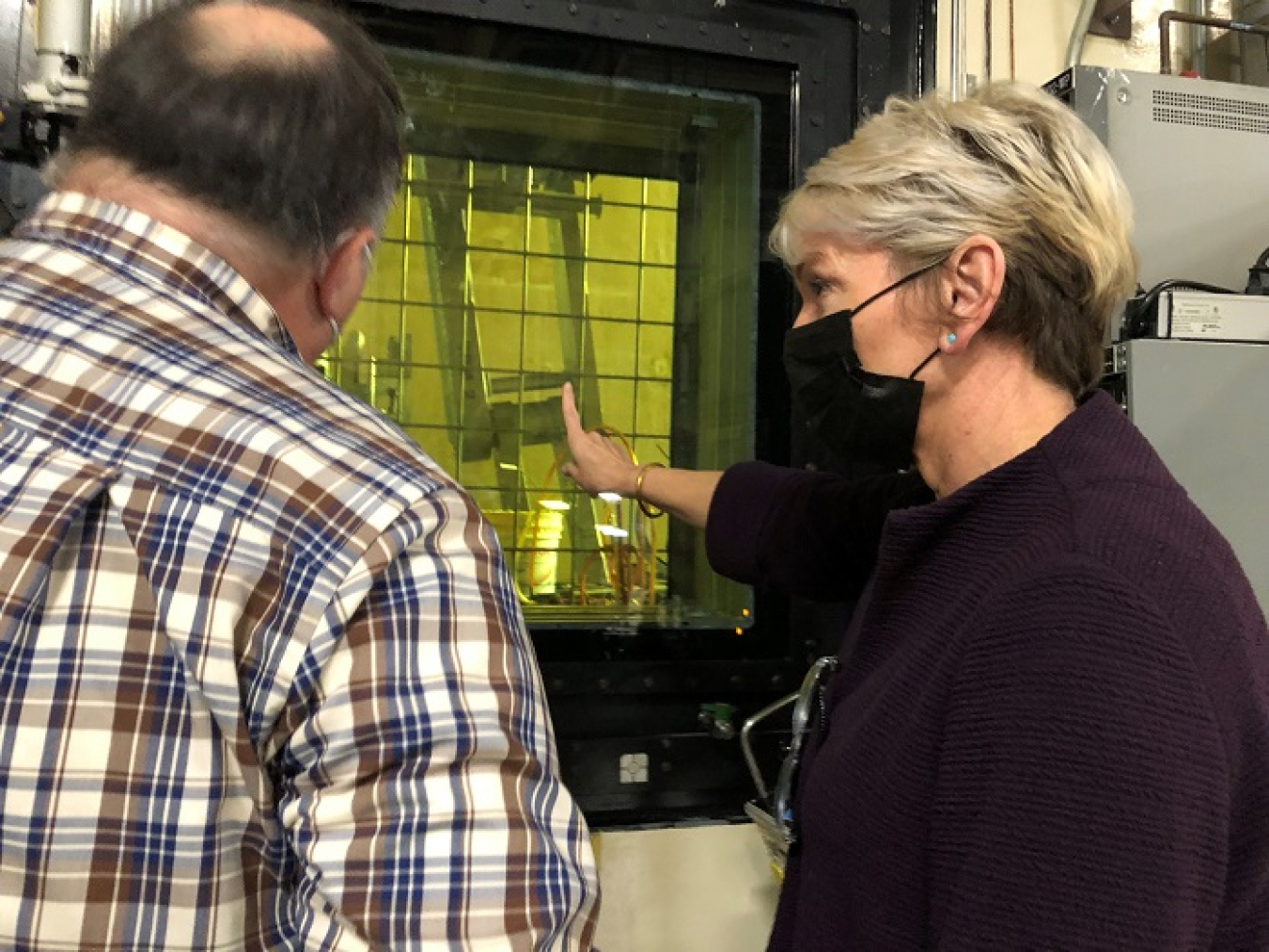 Mark Doyle, facility representative, gives Energy Secretary Jennifer Granholm a firsthand look inside the melt cell of the Savannah River Site’s Defense Waste Processing Facility.