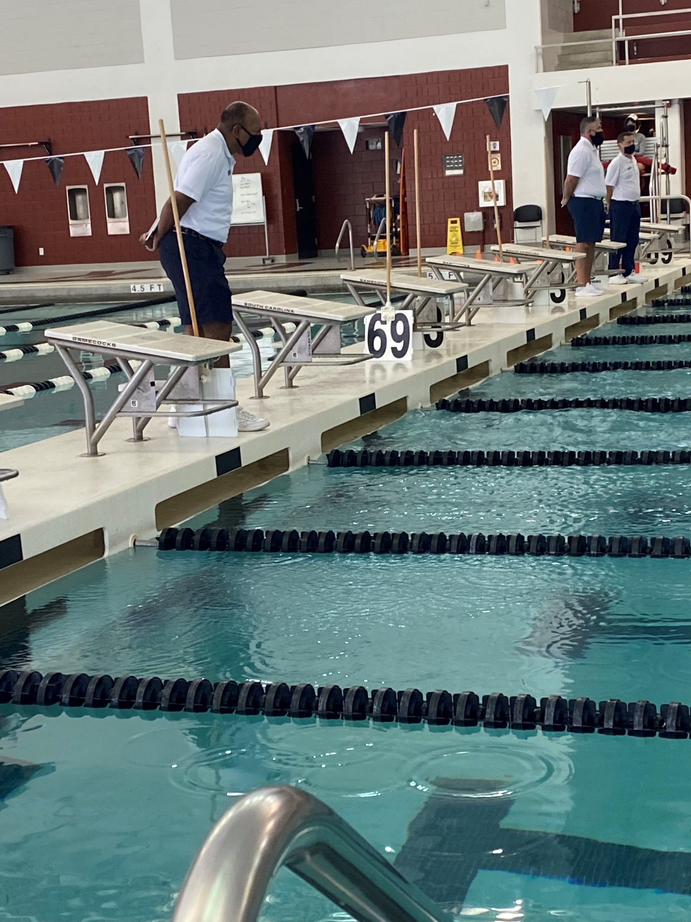 SRFO Deputy Manager Jeff Allison officiating a high school swim meet