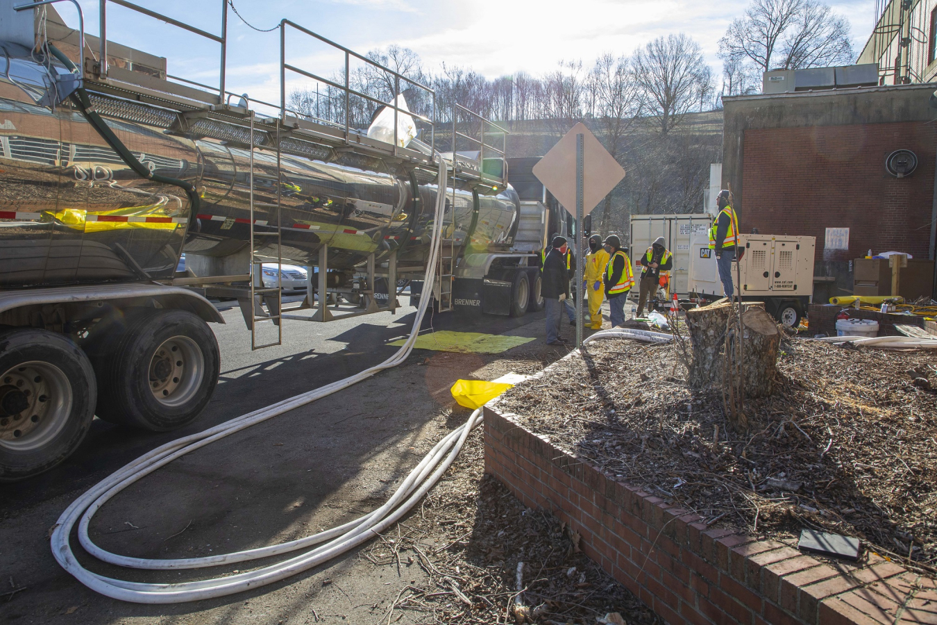 Water is pumped from the Beta-1 facility’s basement into a tanker truck. Employees conducted sampling to determine the appropriate course of disposal for it.