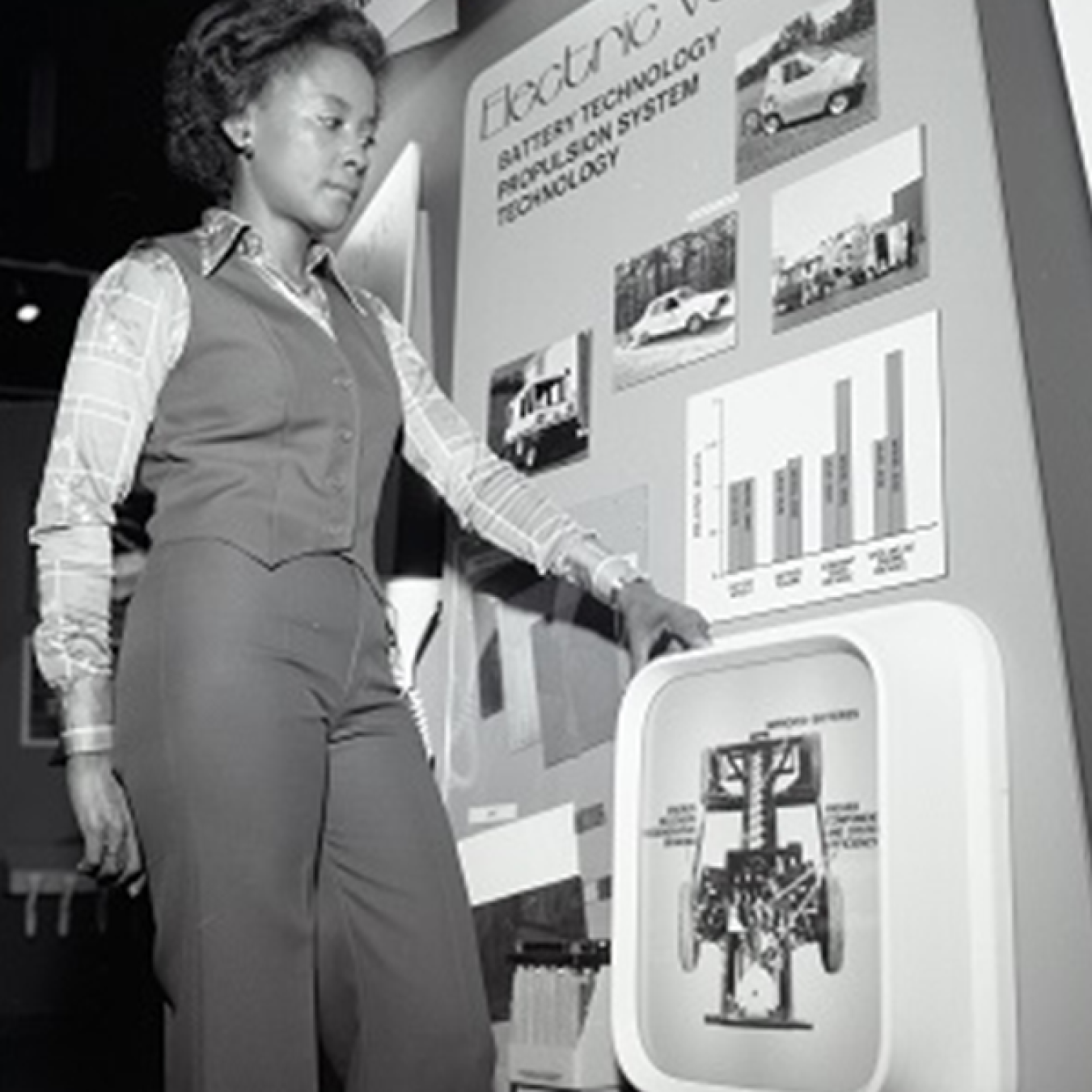 Annie Easley standing with an electric vehicles display.