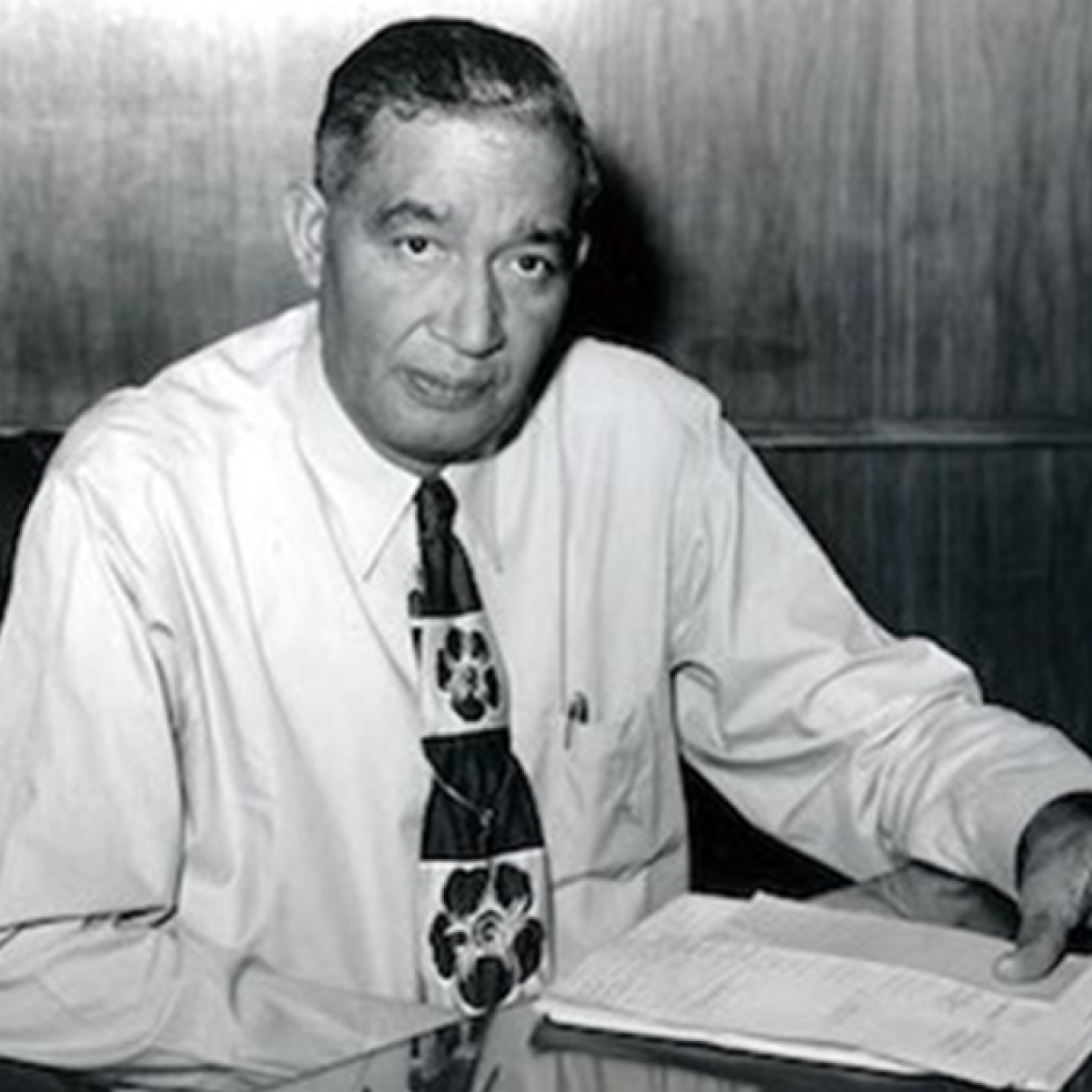 Frederick McKinley Jones looking at the camera with papers in his hand.