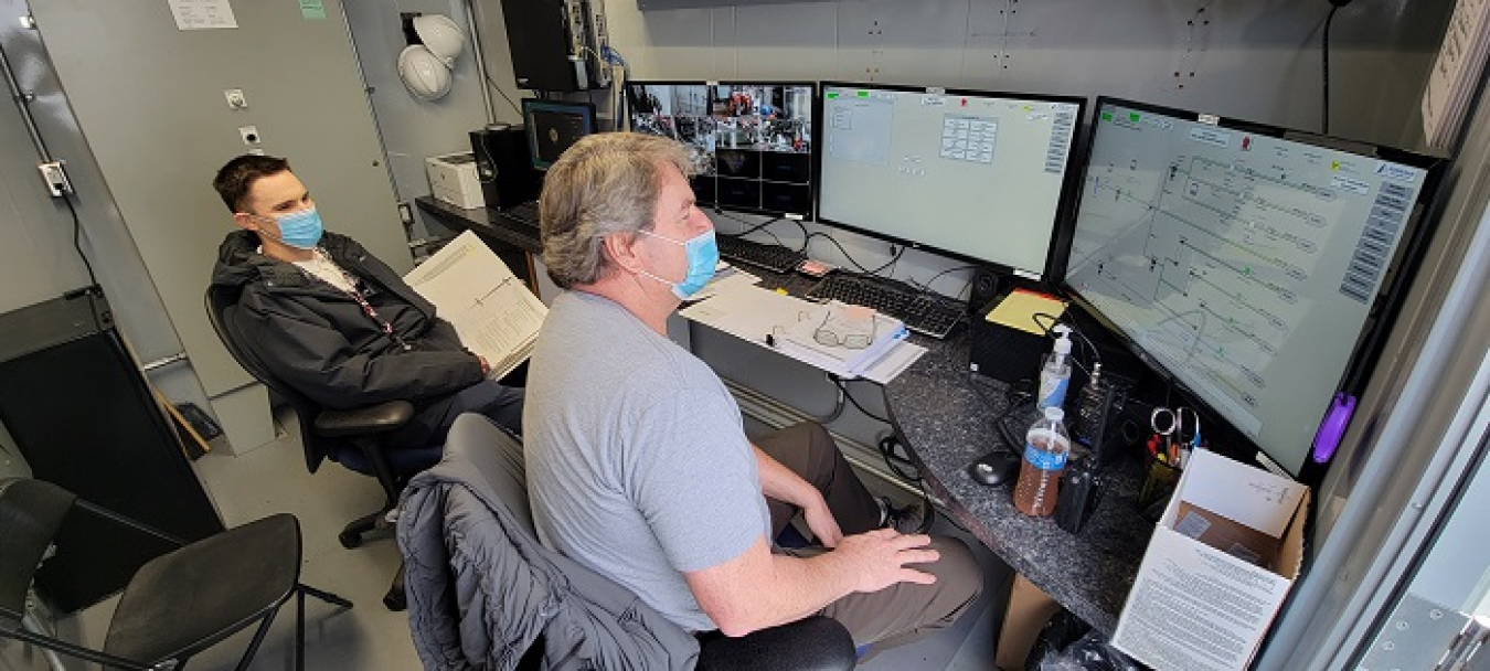 Washington River Protection Solutions operations engineer Steven Porter, left, and nuclear chemical operator Brent Walker monitor the Tank-Side Cesium Removal System in the control room as the system is put in operations mode.