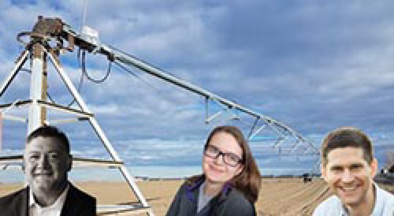 Three people photoshopped in front of a field.