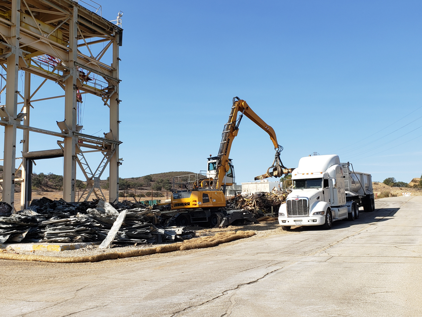 Debris is removed following the Sodium Pump Test Facility demolition.