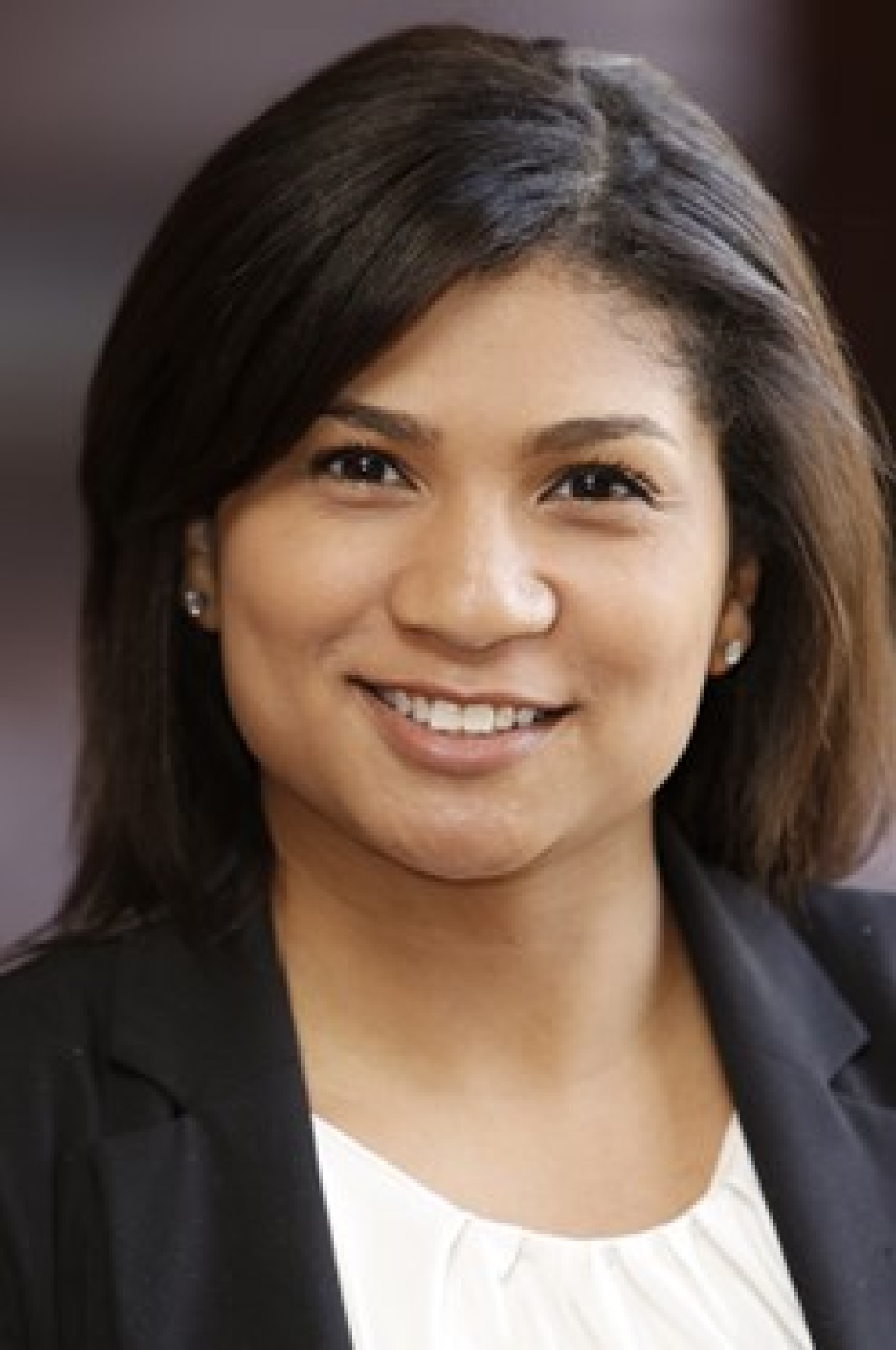 Headshot of a woman smiling.