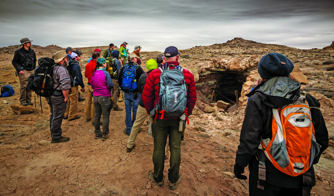 DRUM team members viewing the entrance to an abandoned uranium mine.