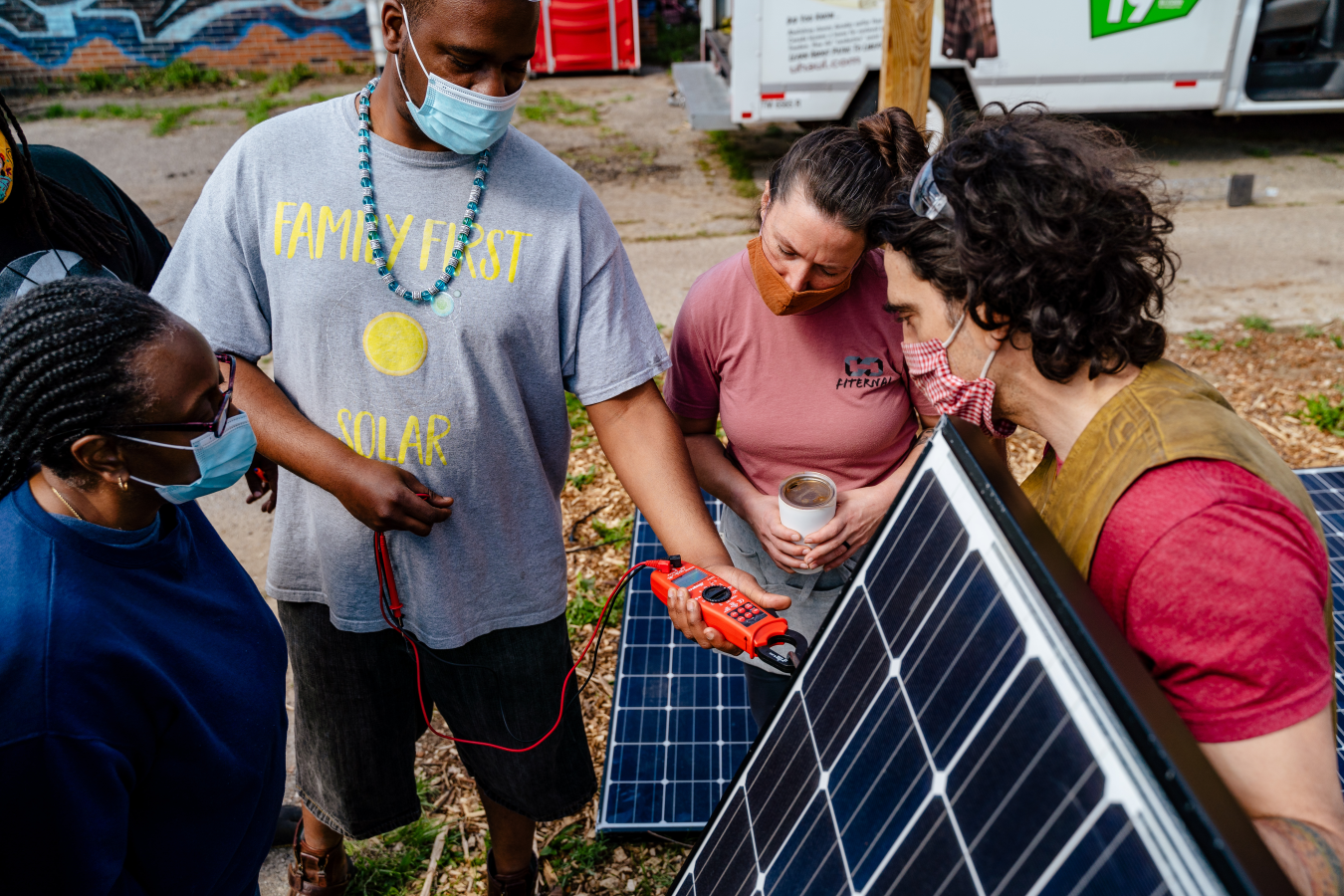 community members from highland park, MI testing solar panels.