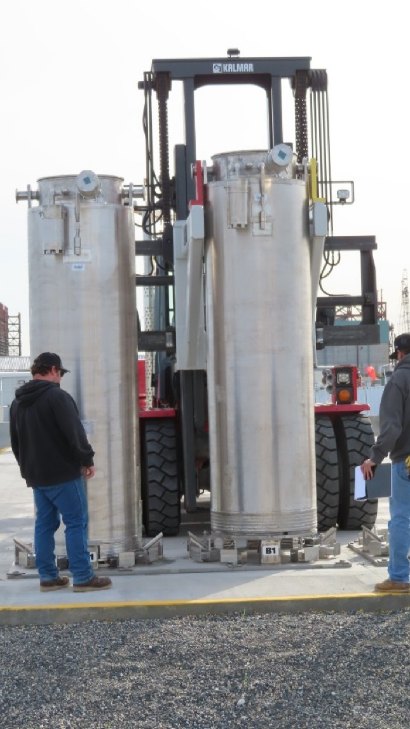 The first two spent ion exchange columns from the Hanford Site’s Tank-Side Cesium Removal System are placed on a concrete pad for safe storage.