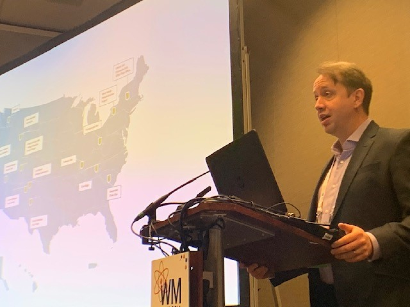 EM Chief of Staff Mike Nartker announces the completion of EM cleanup activities at the Brookhaven National Laboratory in New York during a presentation at the 2022 Waste Management Symposia.