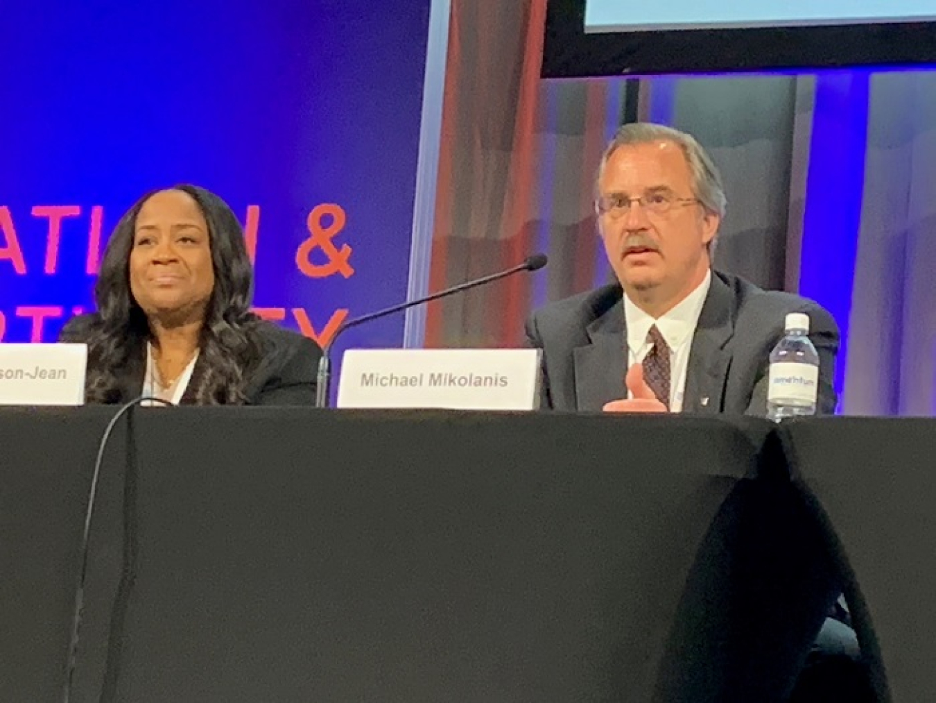 Among the participants of a 2022 Waste Management Symposia panel session focused on EM efforts within the Justice40 Initiative were Nicole Nelson-Jean, EM associate principal deputy assistant secretary for field operations, and Michael Mikolanis, manager of the EM Los Alamos Field Office.