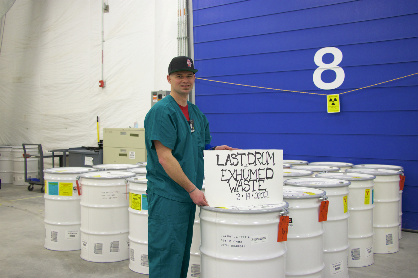 Carl Miller, D&D Skilled Trade employee for DOE Idaho National Laboratory Site cleanup contractor Idaho Environmental Coalition, identifies the last drum of targeted waste exhumed as part of EM’s Accelerated Retrieval Project.